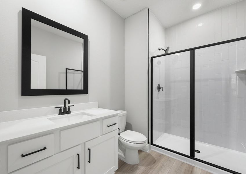 Master bathroom with a step-in shower and matte black fixtures