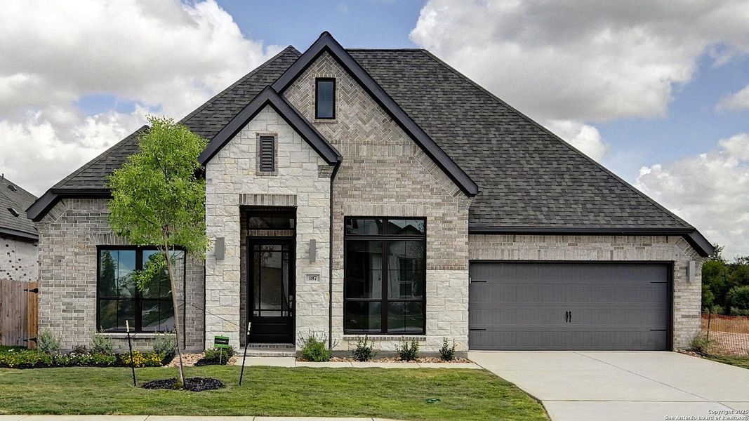 Front exterior of a new home in Alsatian Oaks 60', Castroville, TX, highlighting curb appeal (Image 2). Front exterior of a new home in Alsatian Oaks 60', Castroville, TX, highlighting curb appeal (Image 2).