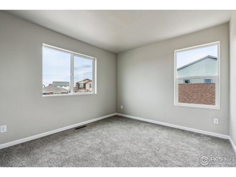 Spacious, unfurnished interior of a new home in Parkway at Prairie Center Village, Brighton (Image 11).