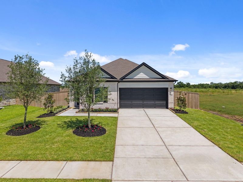 Front exterior of a new home in Arabella on the Prairie, Richmond, TX, highlighting curb appeal (Image 2). Front exterior of a new home in Arabella on the Prairie, Richmond, TX, highlighting curb appeal (Image 2).