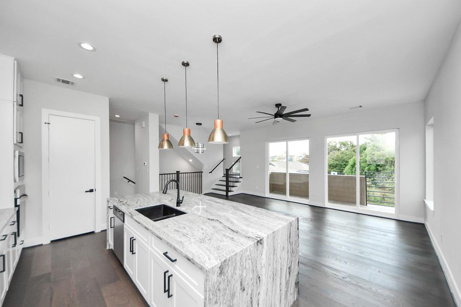 Living area view flowing seamlessly into the kitchen