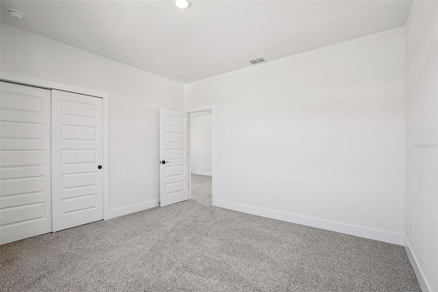 Spacious, unfurnished interior of a new home in Magnolia Bay - Reserve Series, Nokomis (Image 28).