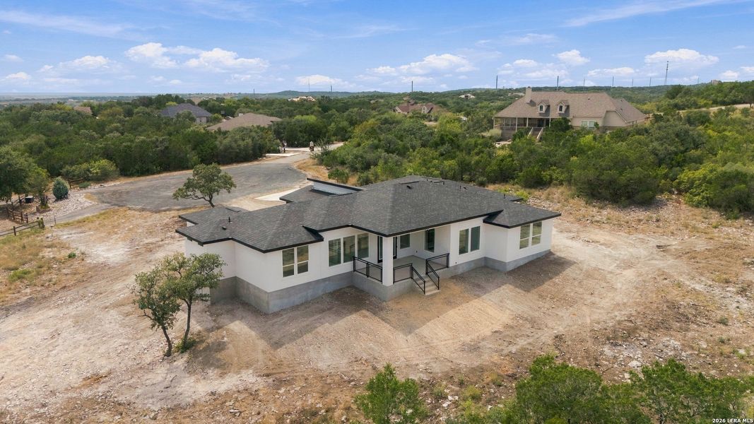 Front exterior of a new home in , Mico, TX, highlighting curb appeal (Image 27).