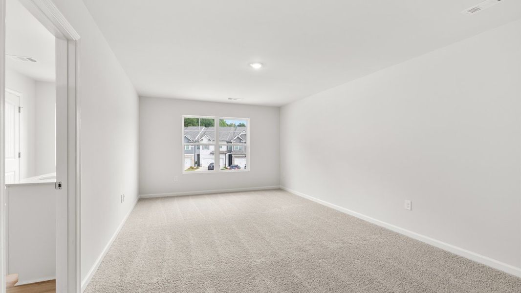 Representative unfurnished interior of a home built from the Salisbury by D.R. Horton in Waypoint, Flowery Branch (Image 20).