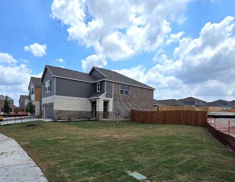 Front exterior of a new home in Salerno - Heritage Collection, Round Rock, TX, highlighting curb appeal (Image 17). Front exterior of a new home in Salerno - Heritage Collection, Round Rock, TX, highlighting curb appeal (Image 17).