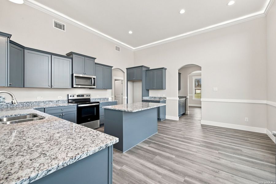Furnished interior view inside a new home in Las Palomas Country Club Estates, La Vernia (Image 8).
