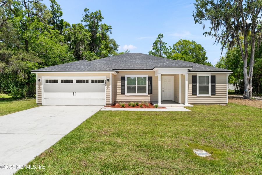 Front exterior of a new home in , Jacksonville, FL, highlighting curb appeal (Image 2). Front exterior of a new home in , Jacksonville, FL, highlighting curb appeal (Image 2).