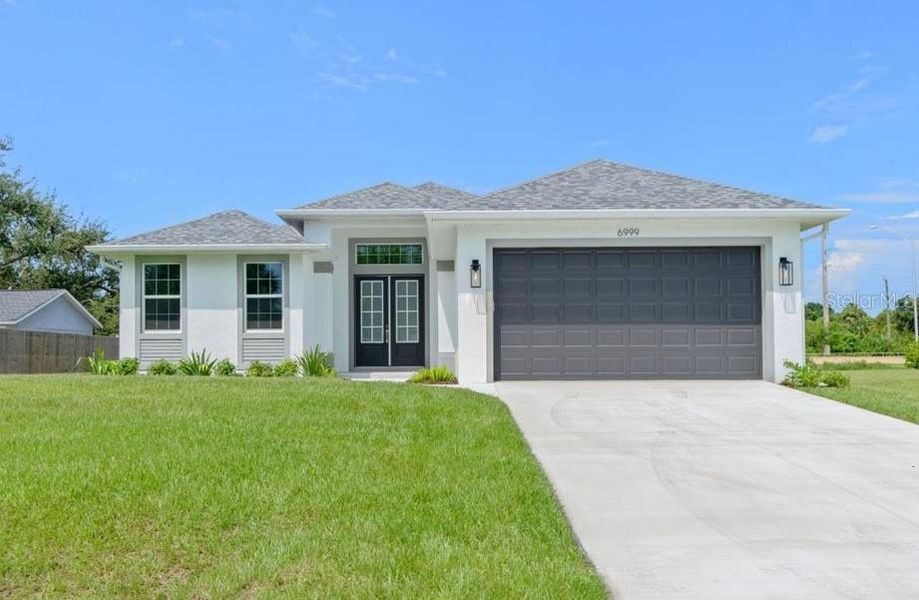 Front exterior of a new home in , Englewood, FL, highlighting curb appeal (Image 16).