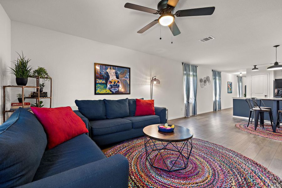 Open-concept living area flows seamlessly into the kitchen and dining space. Open-concept living area flows seamlessly into the kitchen and dining space.