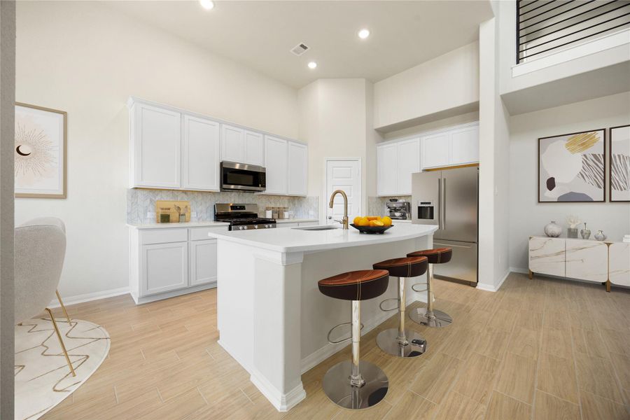 The kitchen features a stylish and functional breakfast bar at the kitchen island, adding ample space for casual dining or gathering. *Virtually Staged The kitchen features a stylish and functional breakfast bar at the kitchen island, adding ample space for casual dining or gathering. *Virtually Staged