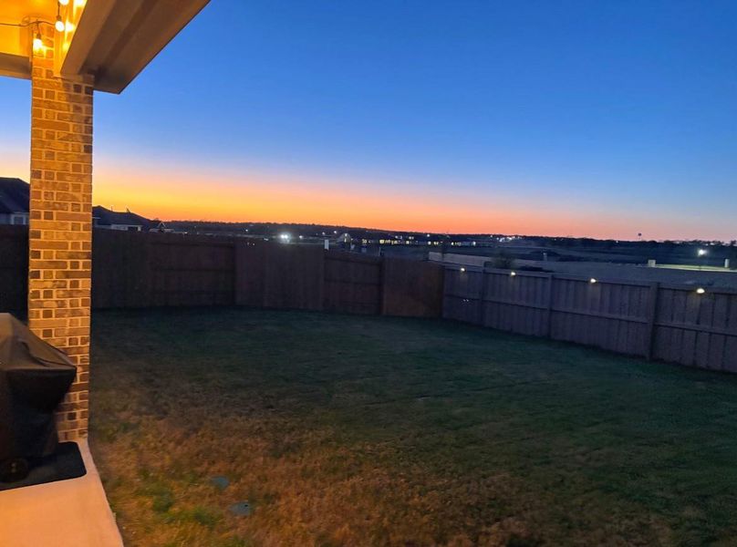 Exterior details and patio area of a home in The Colony, Bastrop (Image 24).