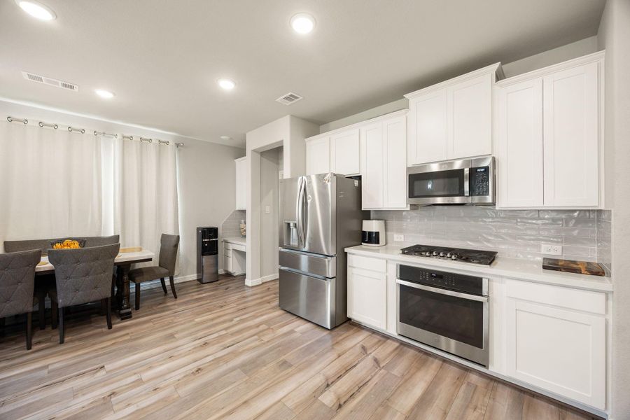Furnished interior view inside a new home in Sunterra 60ft, Katy (Image 12).