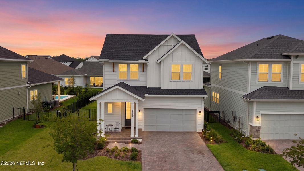 Front exterior of a new home in Seven Pines 40' Front Entry, Jacksonville, FL, highlighting curb appeal (Image 26).