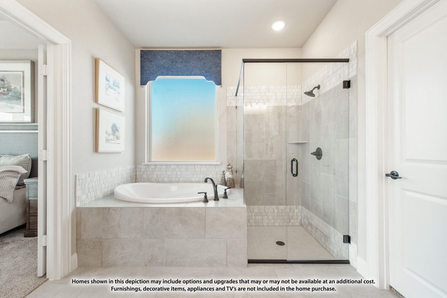 Ensuite bathroom with soaking tub, glass-enclosed walk-in shower, and tile surround Ensuite bathroom with soaking tub, glass-enclosed walk-in shower, and tile surround