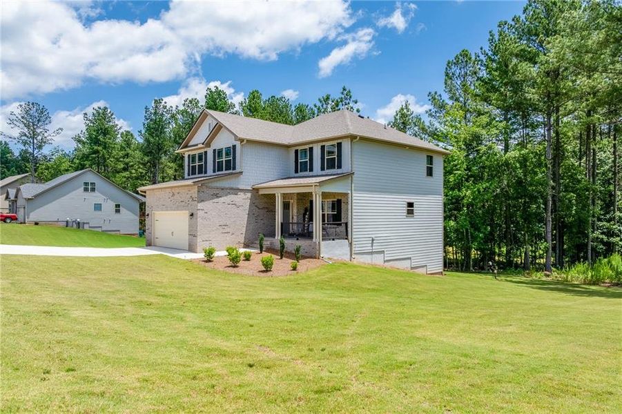 Front exterior of a new home in , Maysville, GA, highlighting curb appeal (Image 20).