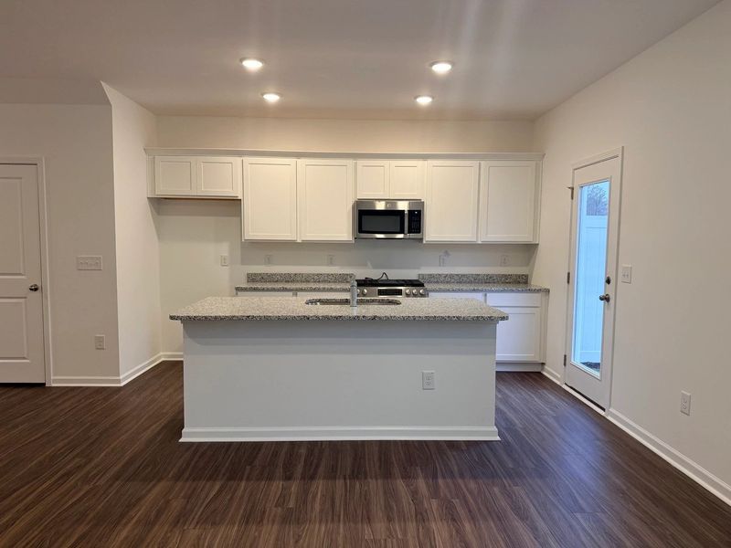 Kitchen - Chic white finishes and smooth surfaces shine. Kitchen - Chic white finishes and smooth surfaces shine.