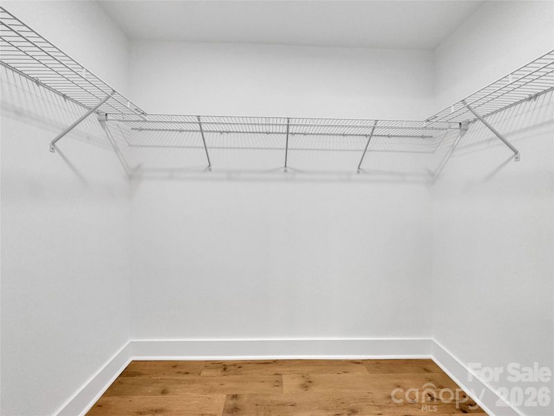 Primary walk-in closet Primary walk-in closet