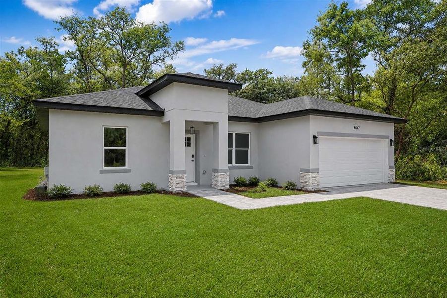 Front exterior of a new home in , Citrus Springs, FL, highlighting curb appeal (Image 18).