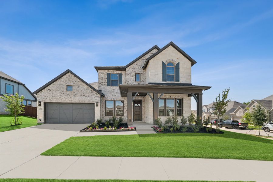 Front exterior of a new home in South Pointe  Village Series, Mansfield, TX, highlighting curb appeal (Image 1).