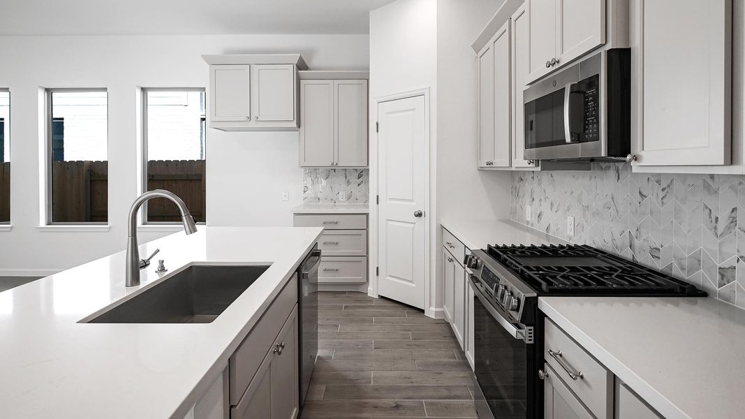 Furnished interior view inside a new home in Crosswinds 40', Kyle (Image 10).