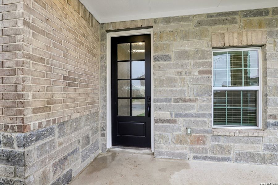 Exterior details and patio area of a home in Hightop Ridge, Converse (Image 4).