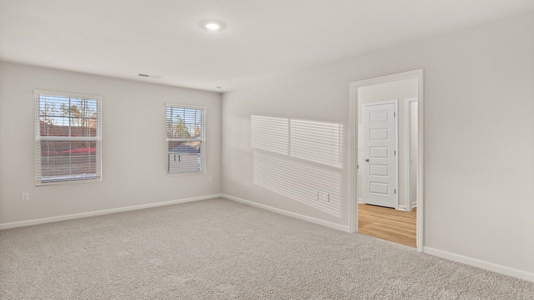 Representative unfurnished interior of a home built from the Hayden by D.R. Horton in Brooks Station, Dacula (Image 20).