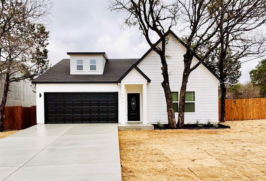 Modern farmhouse style home with a garage