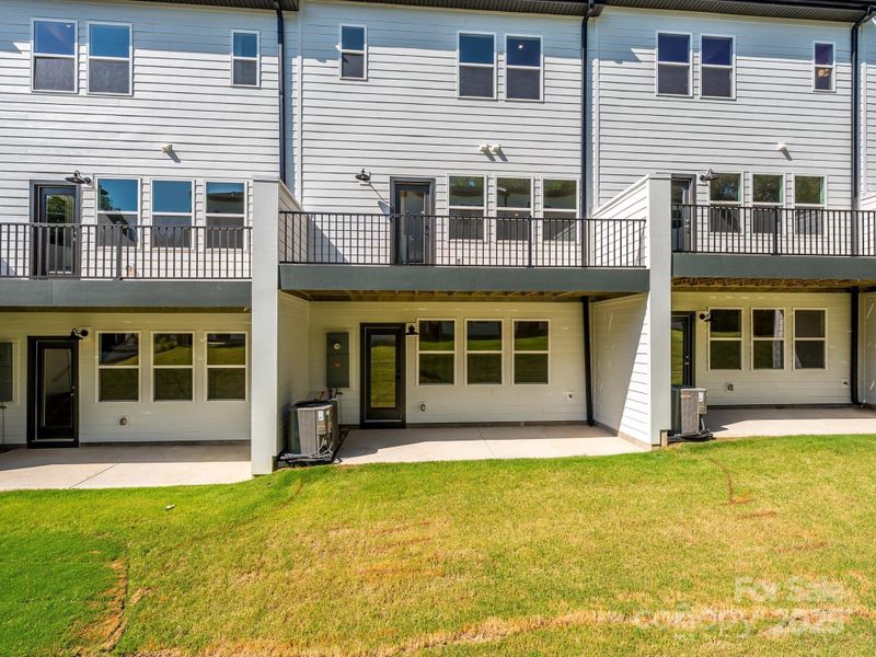Front exterior of a new home in Archer Row, Charlotte, NC, highlighting curb appeal (Image 1).