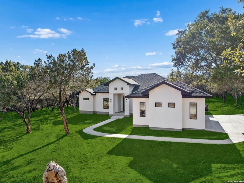 Front exterior of a new home in , Spring Branch, TX, highlighting curb appeal (Image 33).