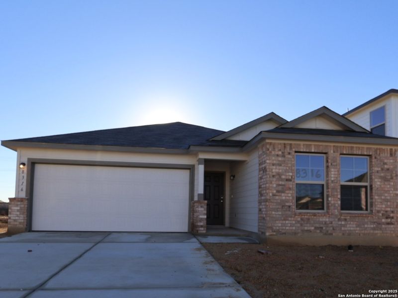 Front exterior of a new home in Agave, San Antonio, TX, highlighting curb appeal (Image 1). Front exterior of a new home in Agave, San Antonio, TX, highlighting curb appeal (Image 1).