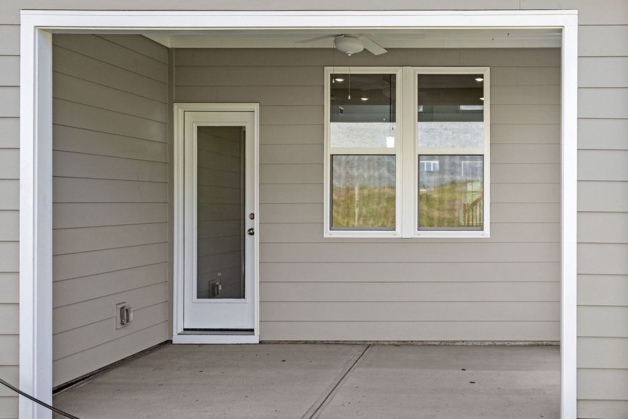 Exterior details and patio area of a home in Ovation at Sweetbrier, Durham (Image 4).