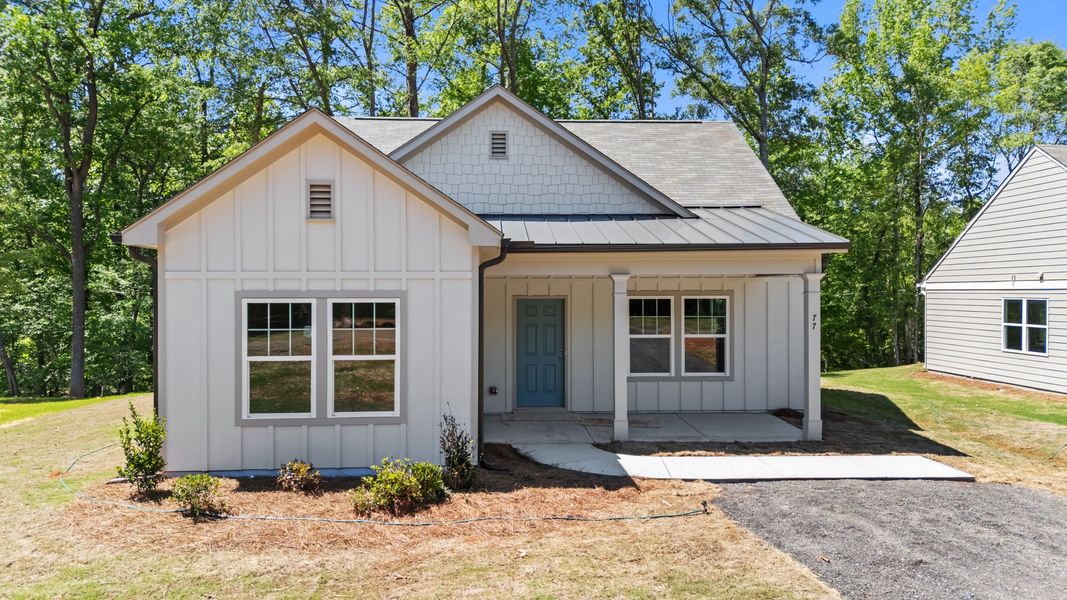 Front exterior of a new home in Clemit Harris Place, Newnan, GA, highlighting curb appeal (Image 1). Front exterior of a new home in Clemit Harris Place, Newnan, GA, highlighting curb appeal (Image 1).