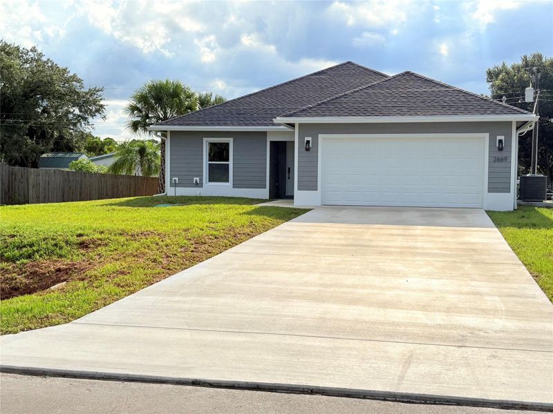 Front exterior of a new home in , Okeechobee, FL, highlighting curb appeal (Image 18).