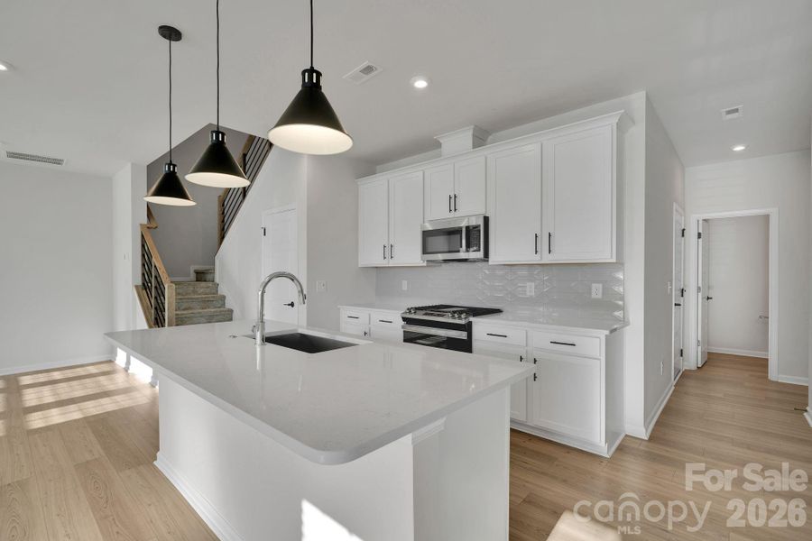 Furnished interior view inside a new home in Trellis at The Commons, Charlotte (Image 13). Furnished interior view inside a new home in Trellis at The Commons, Charlotte (Image 13).