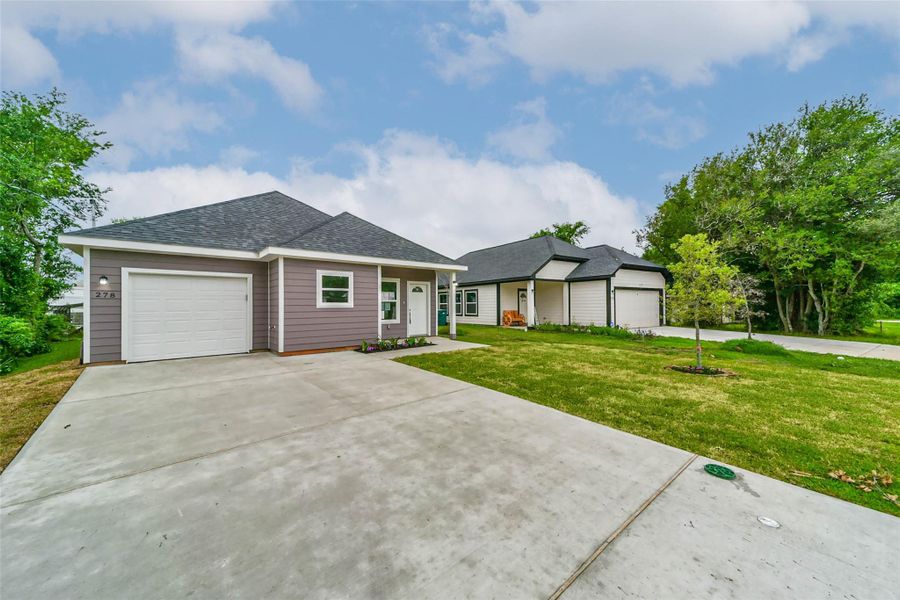 Front exterior of a new home in , Conroe, TX, highlighting curb appeal (Image 22).