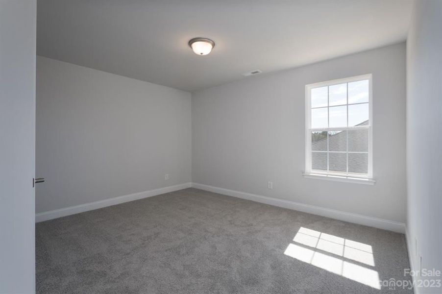 Representative unfurnished interior of a home built from the 3119 by Adams Homes in Hidden Pines, Cameron (Image 27).