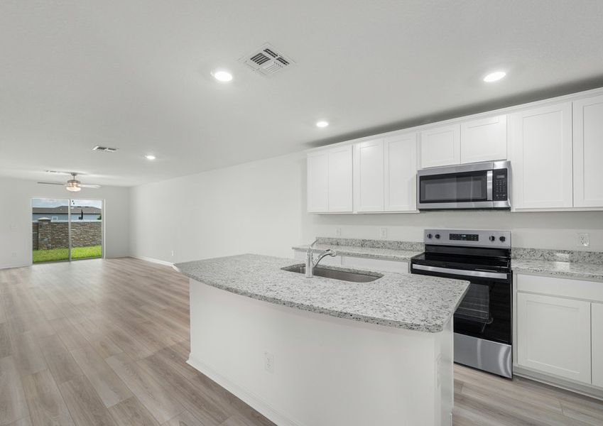 The front foyer leads to the chef-ready kitchen