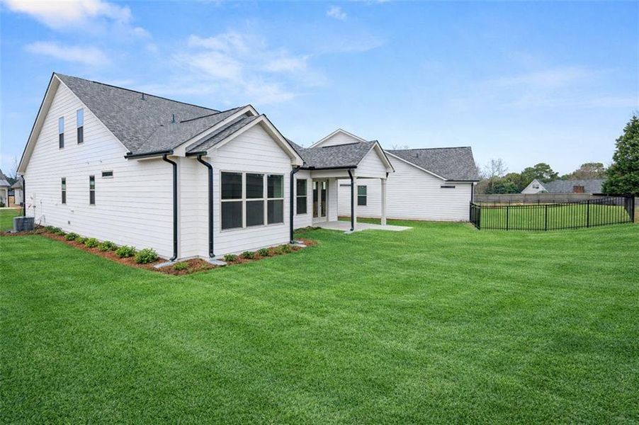 Exterior details and patio area of a home in Soleil Summit Chase, Snellville (Image 31).