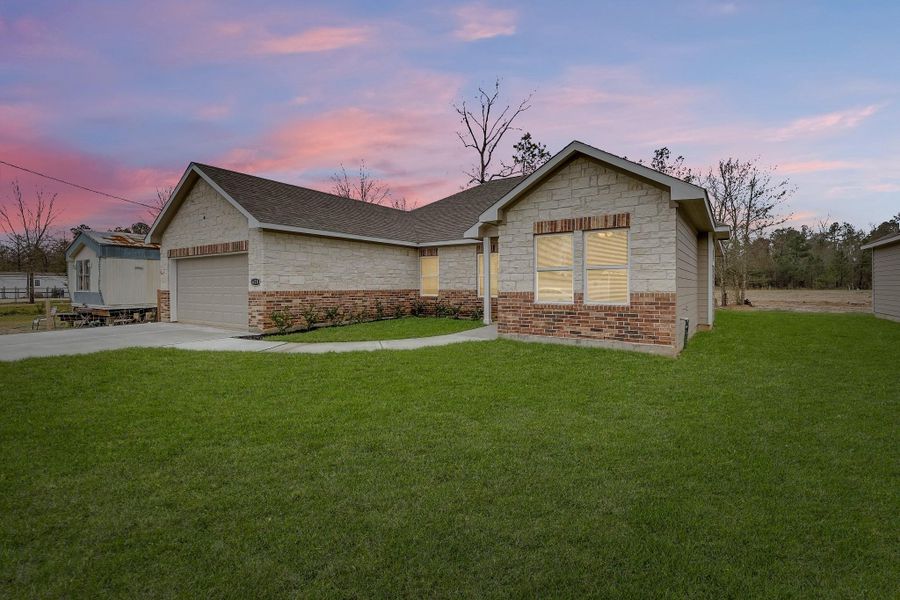 Charming brick facade adds timeless appeal and durability, enhancing the home's curb appeal and overall character.