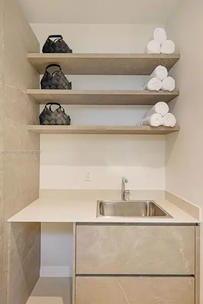 laundry room with built in cabinetry laundry room with built in cabinetry
