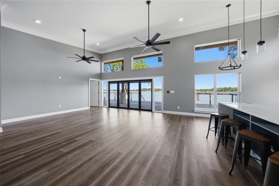 Wall of sliding patio  doors all bookcase open to expand your entertaining space to spill over onto the patio!