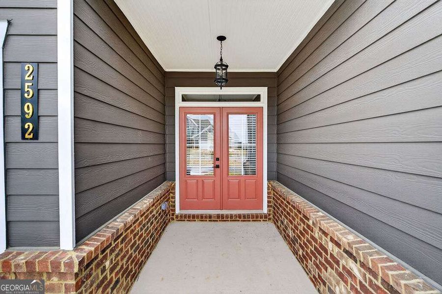Exterior details and patio area of a home in The Manor at Gainesville Township, Gainesville (Image 3).