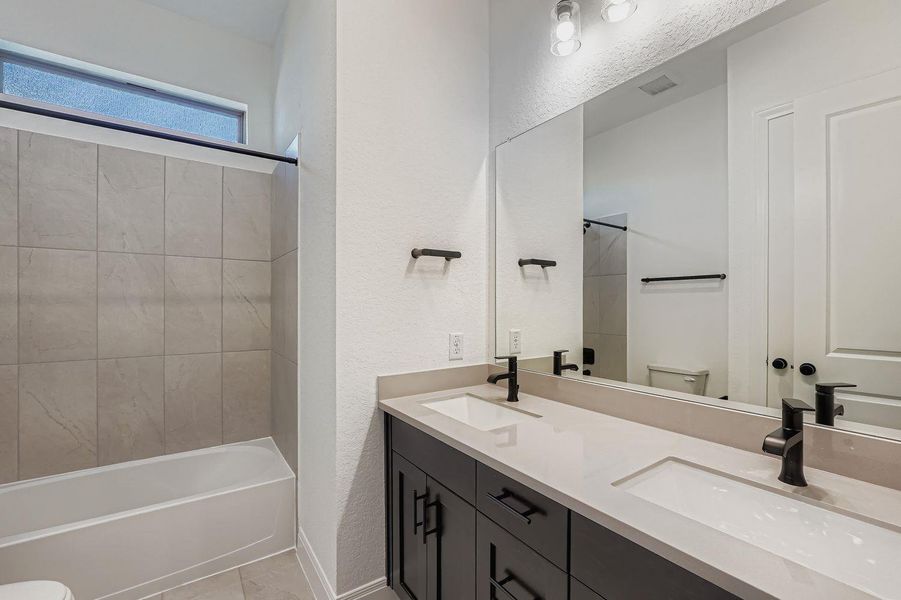 Furnished interior view inside a new home in 6 Creeks, Kyle (Image 4).