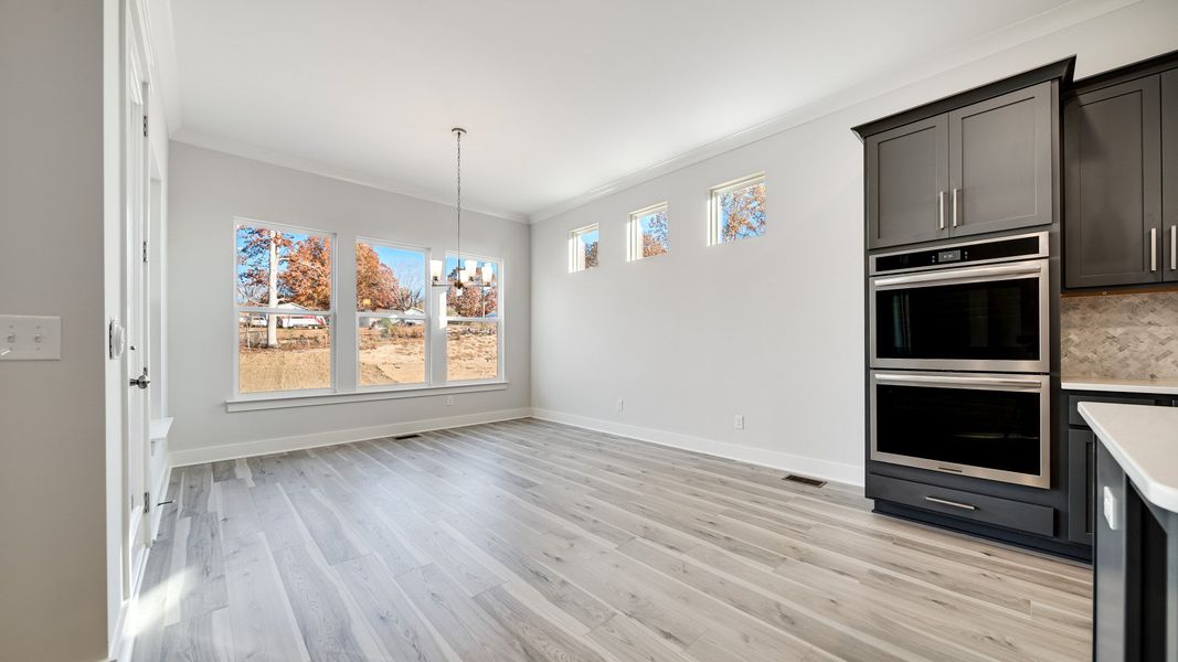 Open Dining area with large amount of natural light near the kitchen