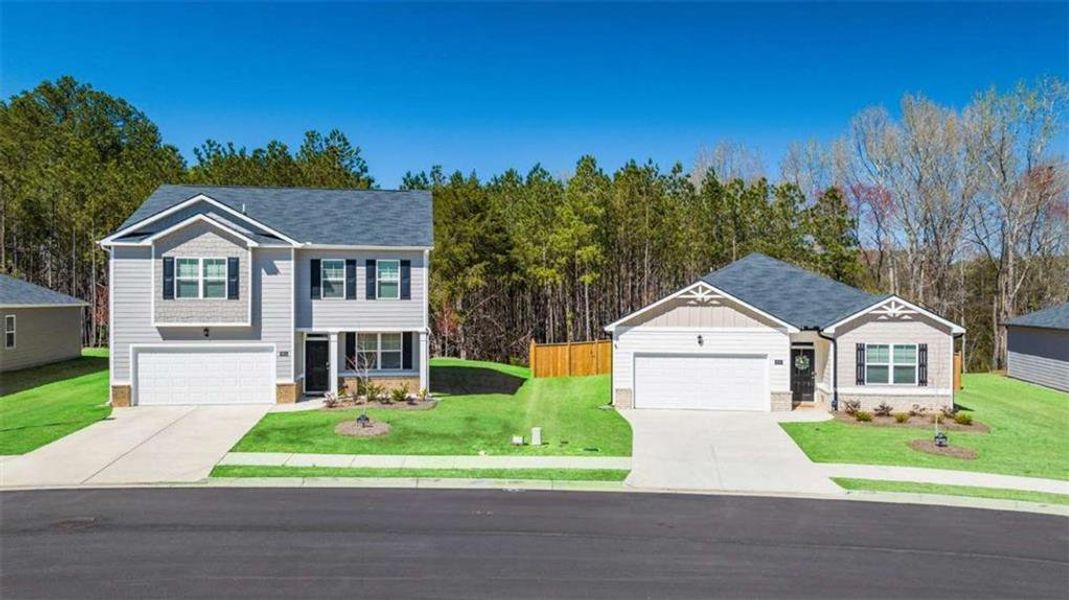 Front exterior of a new home in Champion's Run, Lithonia, GA, highlighting curb appeal (Image 17). Front exterior of a new home in Champion's Run, Lithonia, GA, highlighting curb appeal (Image 17).