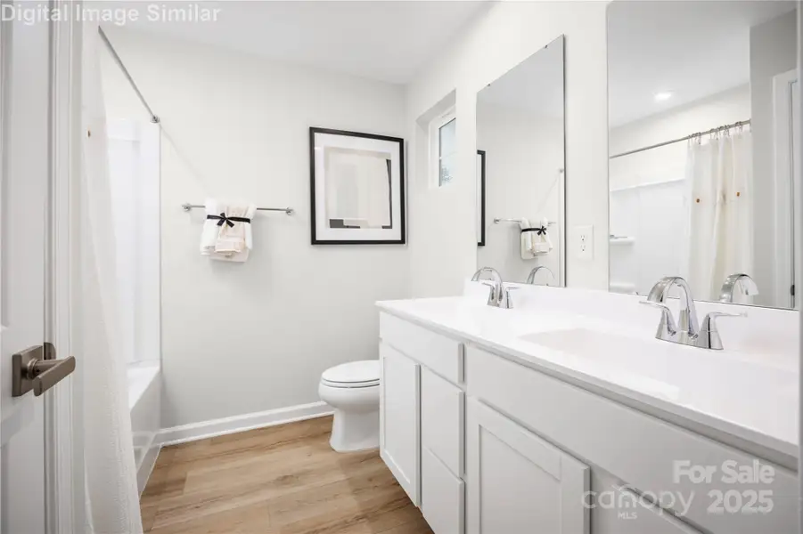 Relax and recharge in this spa-inspired owner’s bath—featuring dual ceramic sinks, generous space, and thoughtful storage for everyday luxury. Relax and recharge in this spa-inspired owner’s bath—featuring dual ceramic sinks, generous space, and thoughtful storage for everyday luxury.