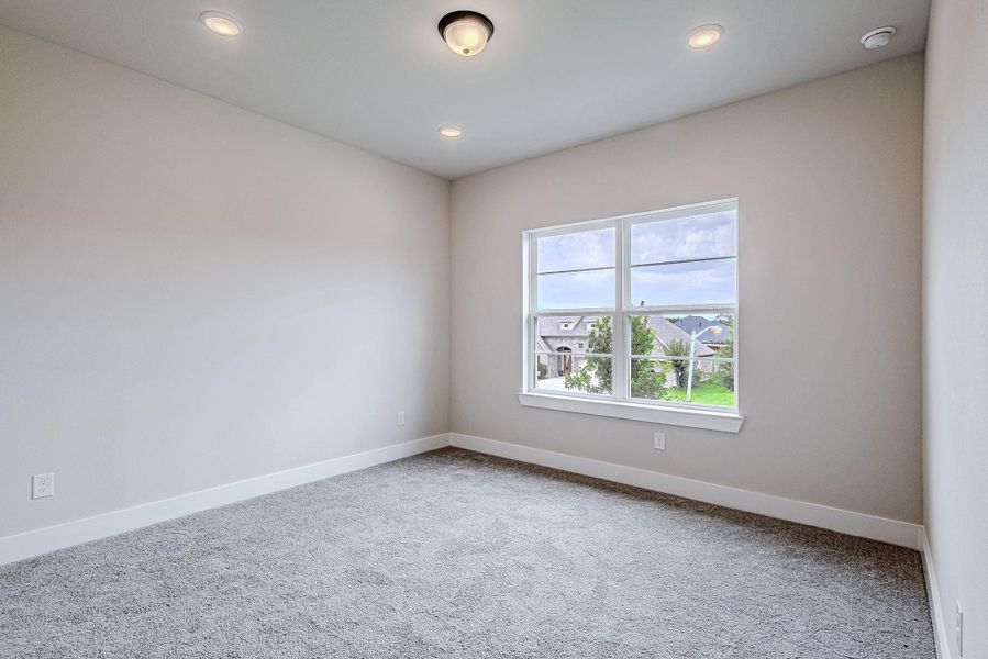 Bright secondary bedroom with neighborhood views Bright secondary bedroom with neighborhood views