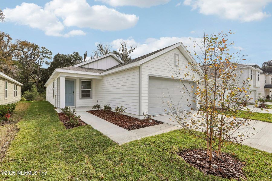 Front exterior of a new home in Kings Landing, Jacksonville, FL, highlighting curb appeal (Image 17). Front exterior of a new home in Kings Landing, Jacksonville, FL, highlighting curb appeal (Image 17).