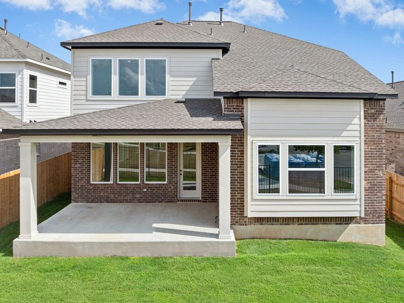 Exterior details and patio area of a home in University Heights, Round Rock (Image 26).