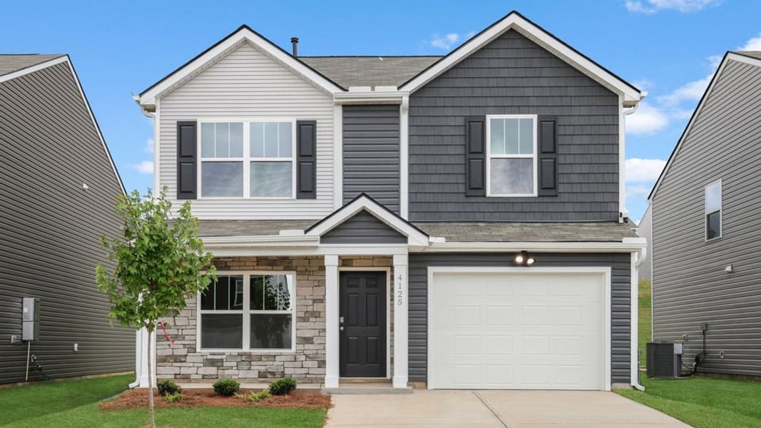 Front exterior of a new home in Baxter Village, Boiling Springs, SC, highlighting curb appeal (Image 1). Front exterior of a new home in Baxter Village, Boiling Springs, SC, highlighting curb appeal (Image 1).